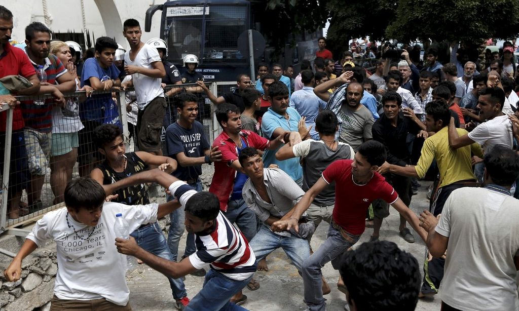 ATTENTION EDITORS - REUTERS PICTURE HIGHLIGHTPakistani, Iranian and Afghani migrants scuffle outside the police station of the city of Kos over priority at a registration queue on the Greek island of Kos, August 15, 2015. The United Nations refugee agency (UNHCR) called on Greece to take control of the "total chaos" on Mediterranean islands, where thousands of migrants have landed. About 124,000 have arrived this year by sea, many via Turkey, according to Vincent Cochetel, UNHCR director for Europe. REUTERS/Alkis Konstantinidis TPX IMAGES OF THE DAYREUTERS NEWS PICTURES HAS NOW MADE IT EASIER TO FIND THE BEST PHOTOS FROM THE MOST IMPORTANT STORIES AND TOP STANDALONES EACH DAY. Search for "TPX" in the IPTC Supplemental Category field or "IMAGES OF THE DAY" in the Caption field and you will find a selection of 80-100 of our daily Top Pictures.REUTERS NEWS PICTURES. TEMPLATE OUT