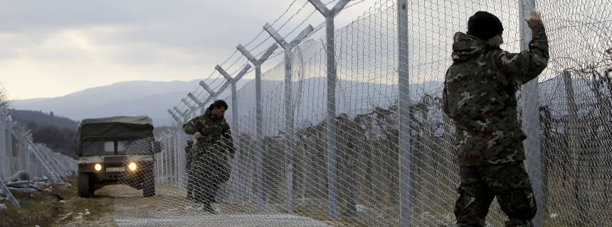 FILE - In this February 8, 2016 file photo, Macedonian Army soldiers erect a second fence on the border line with Greece, near the southern Macedonia's town of Gevgelija. Six nations from Central and Eastern Europe meet Monday in Prague to discuss plans for a new “line of defense” for Europe that involves a double fence along Greece’s northern border. (AP Photo/Boris Grdanoski, File)